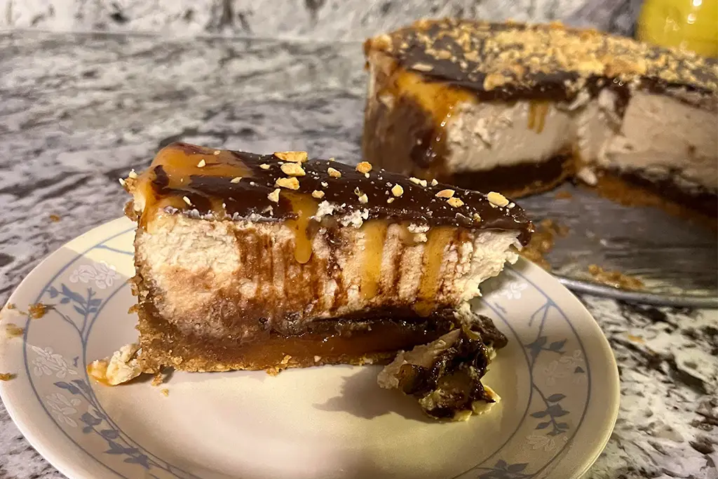 Slice of turtle cheesecake